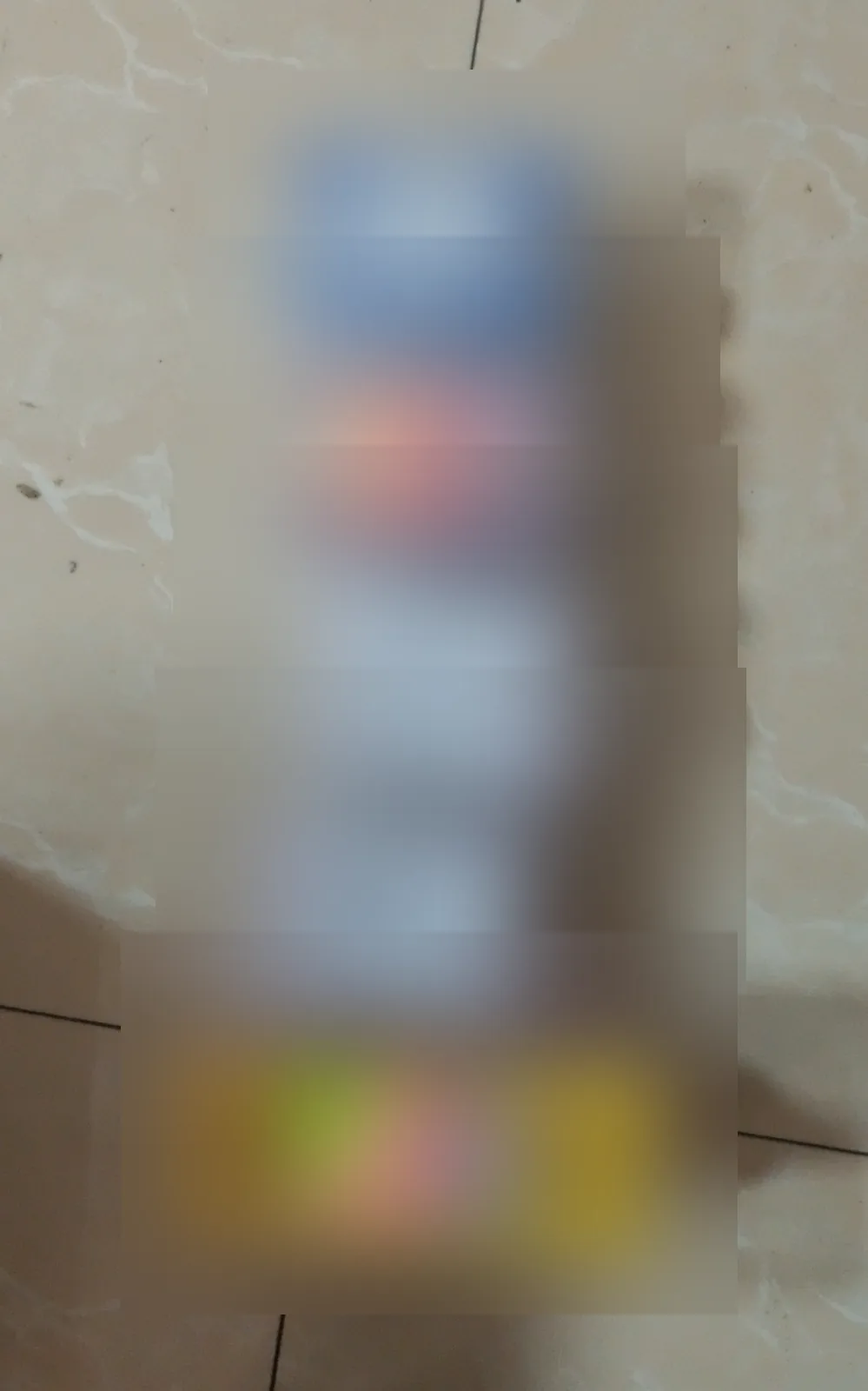 Stacked product packages with all label details obscured for public display